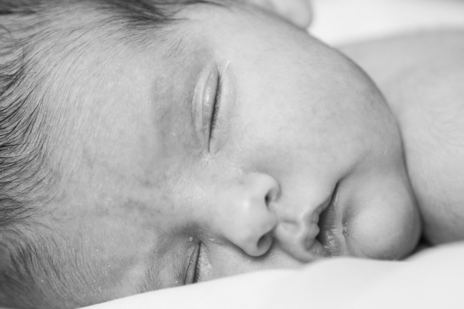 black and white closeup portrait of newborn baby